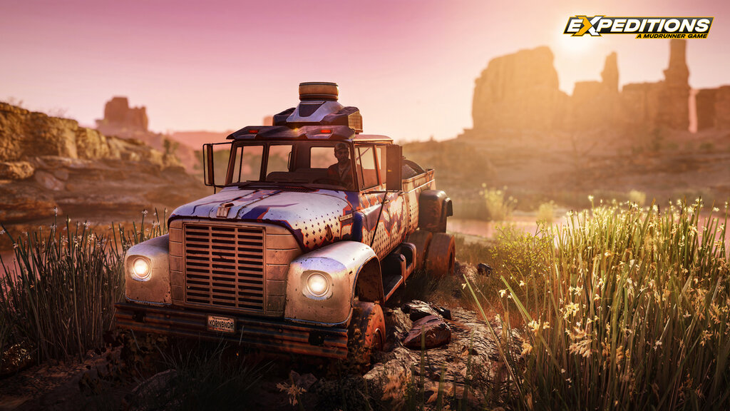 Screenshot von Expeditions: A MudRunner Game. Blauer Truck fährt, dahinter ein Sonnenuntergang.